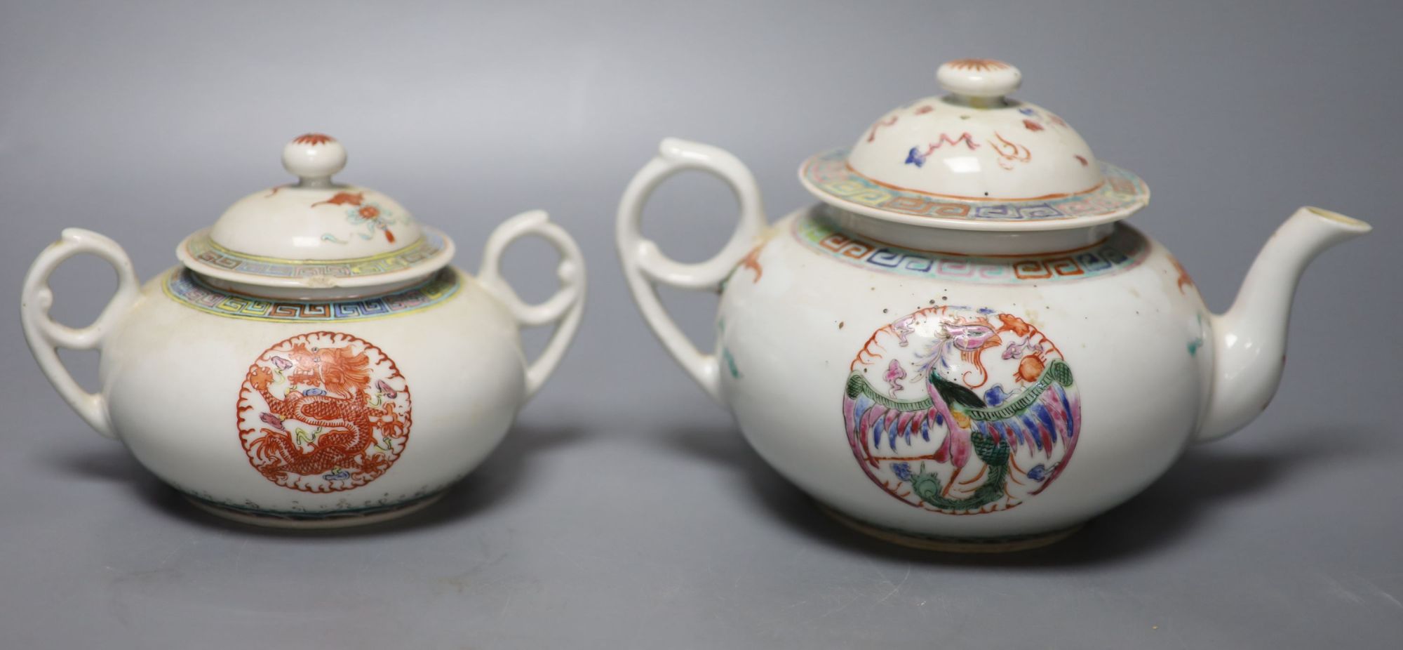 A Chinese famille rose teapot and sucrier, a 19th century Chinese bowl and a pair of blue and white bowls